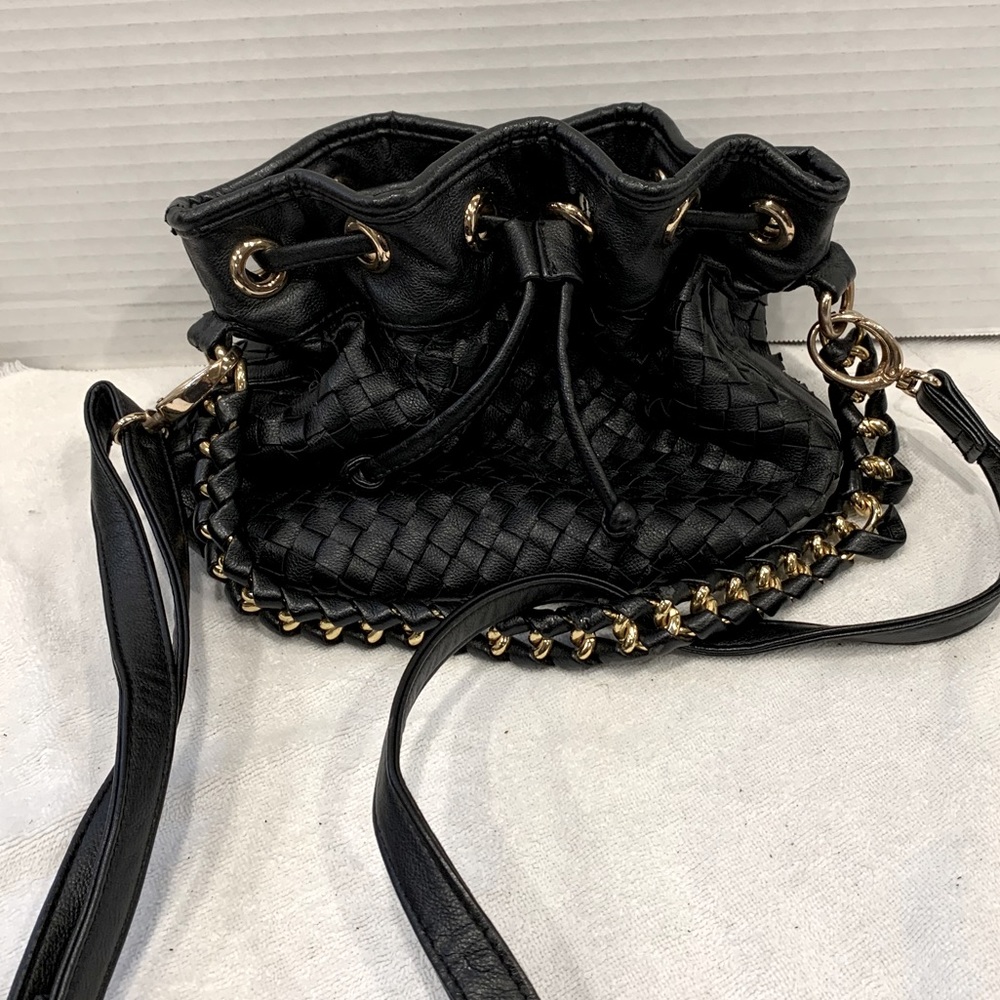 Black leather bag gold accent